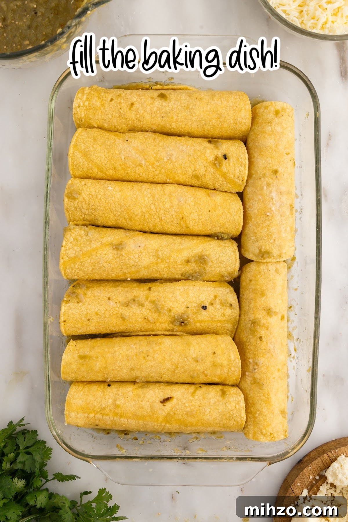 A 9x13 dish filled with rolled Green Chicken Enchiladas with text overlay.