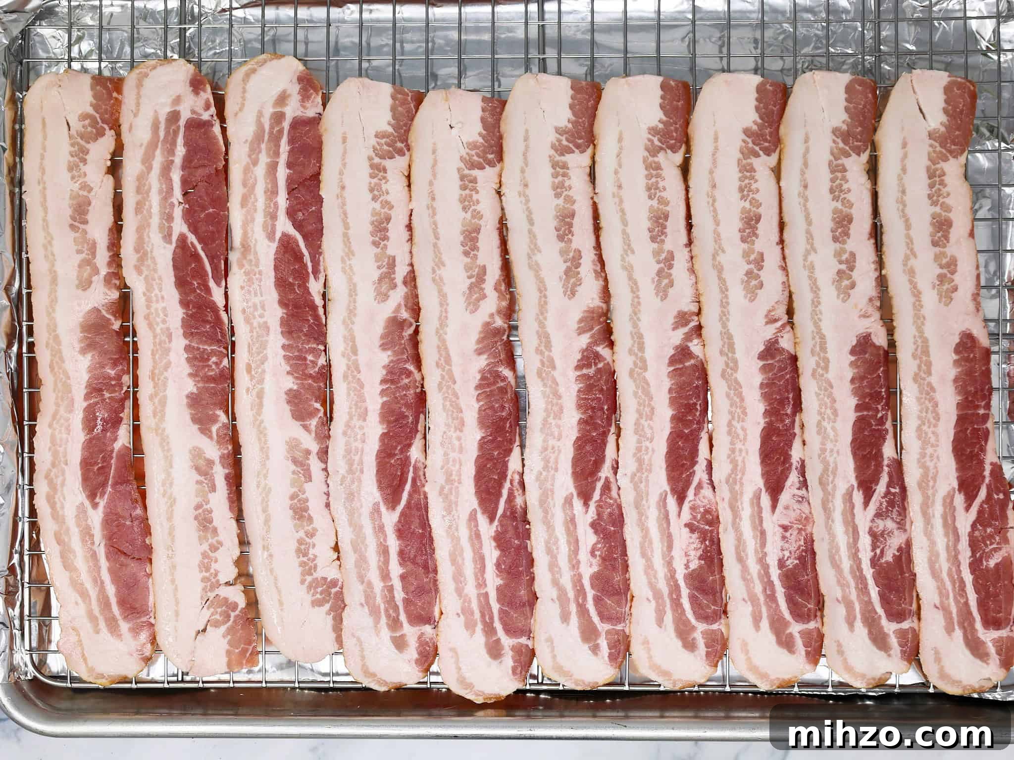 How to Make Perfect Crispy Bacon in the Oven 5 slices of bacon going into the oven