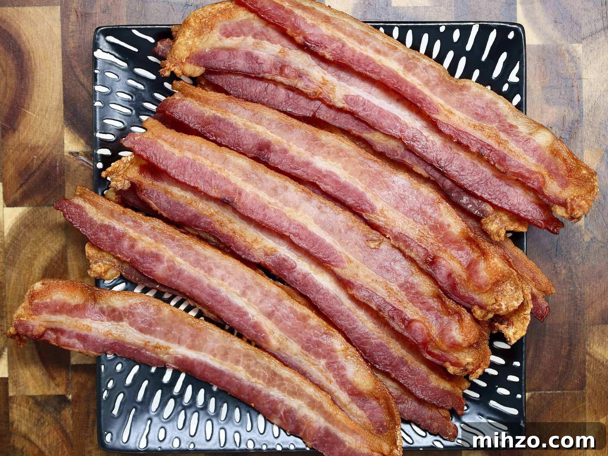 How to Make Perfect Crispy Bacon in the Oven 7 a plate of oven bacon ready for serving