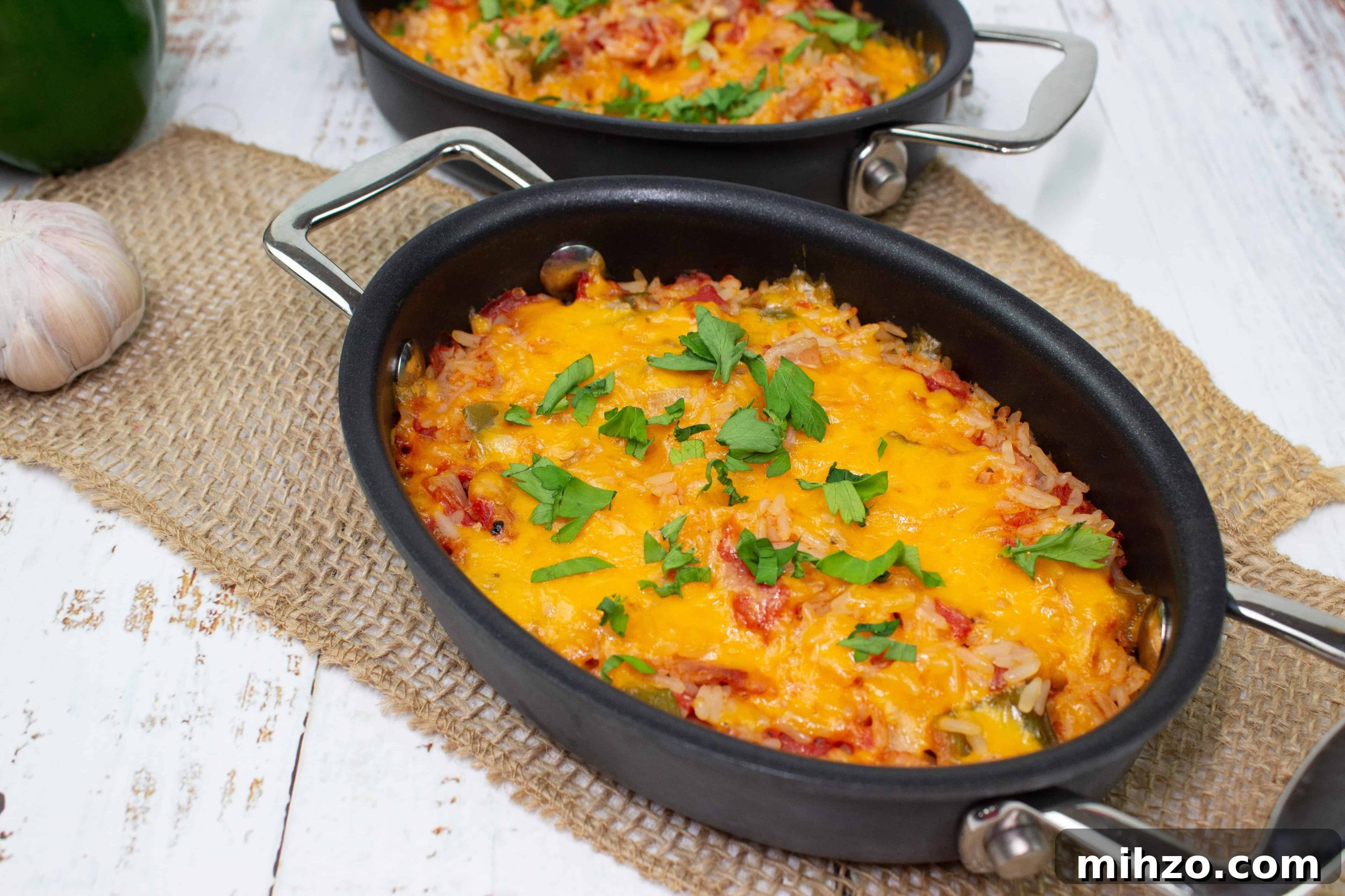 Cubano Sandwich Casserole and 12 Hearty Family Casseroles 11 Baked Spanish Rice in two black baking dishes.