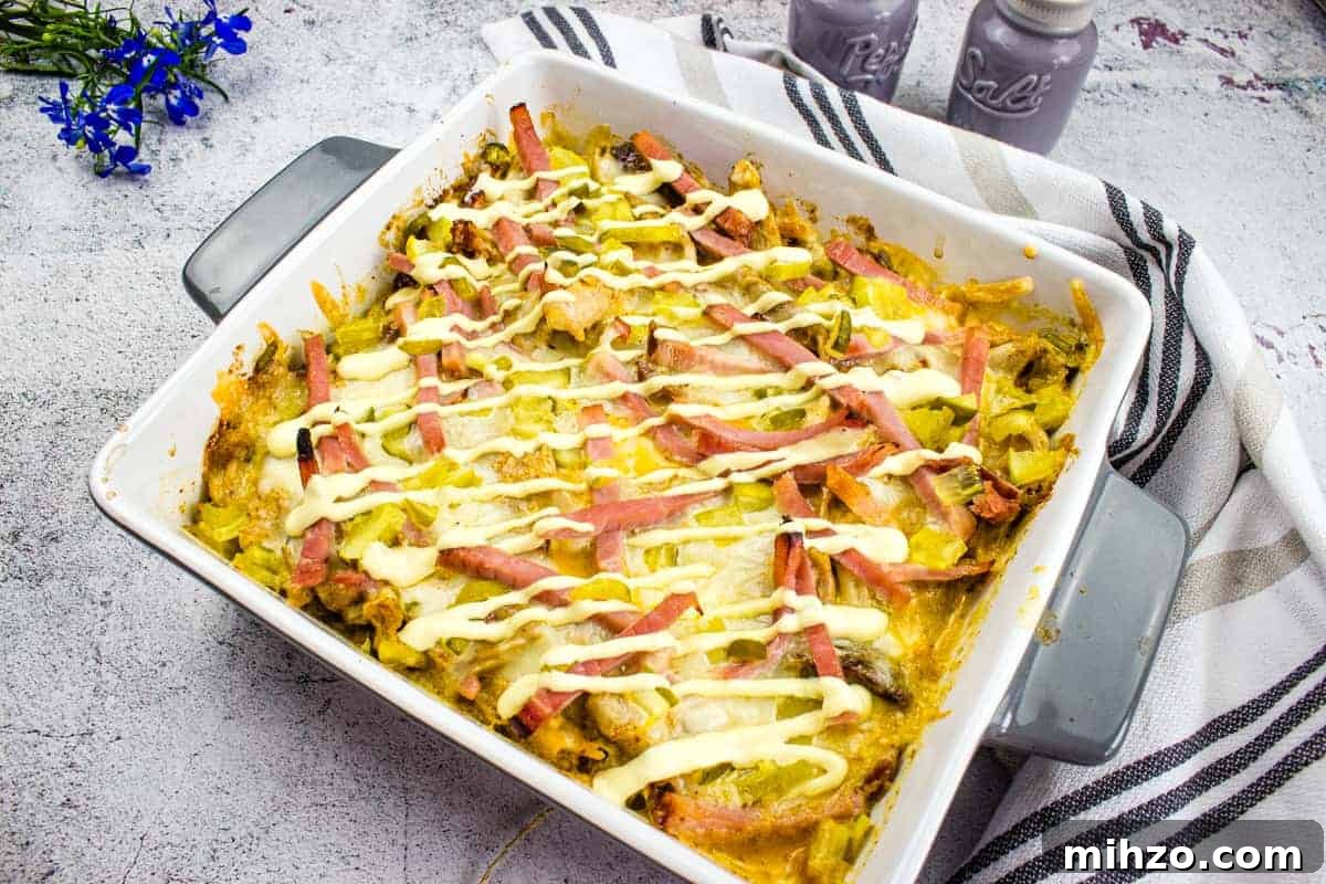 Cubano Sandwich Casserole and 12 Hearty Family Casseroles 15 A closeup shot of Cuban Casserole in a baking dish.