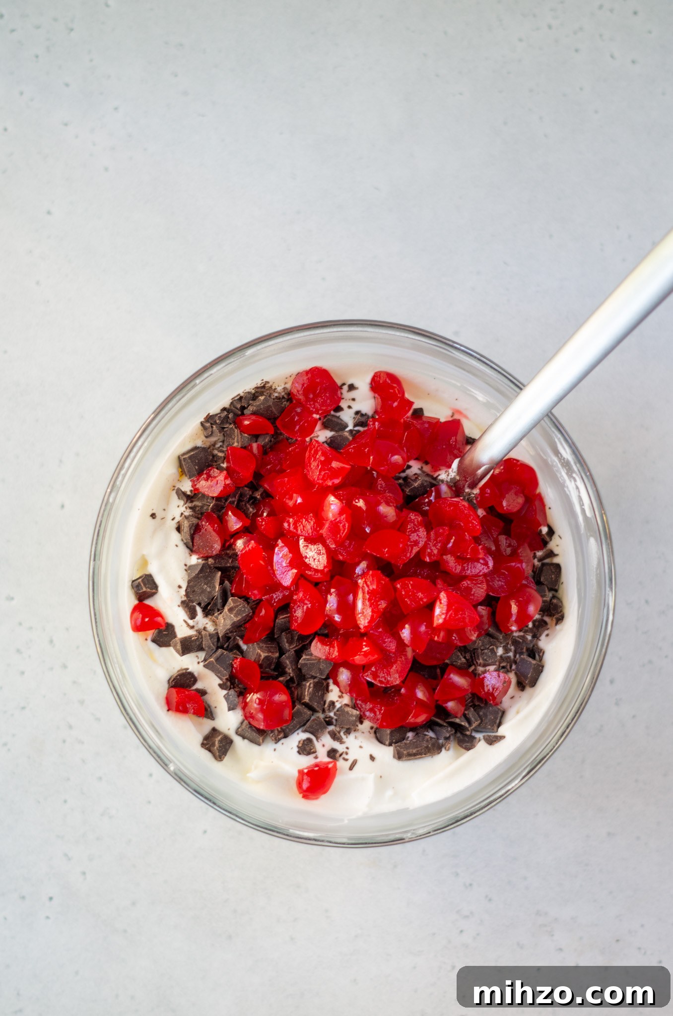 ingredients for cherry cordial ice cream in a bowl