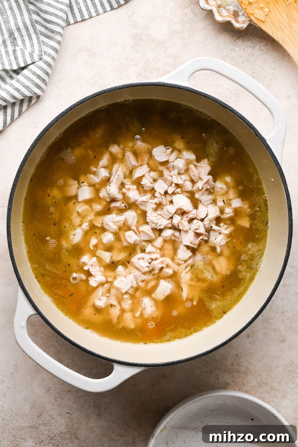 Delicious Dairy-Free Chicken and Broccoli Soup Recipe 11 How to make Chicken and Broccoli Soup: Chicken broth and shredded chicken added to the soup pot.