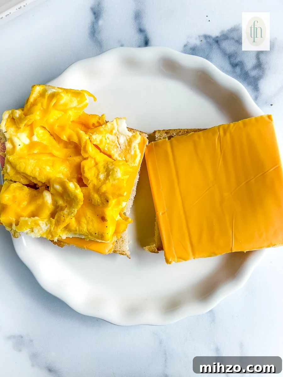 Sourdough Breakfast Sandwich Ideas for Quick Morning Meals 9 Open faced scrambled egg sandwich with American cheese.