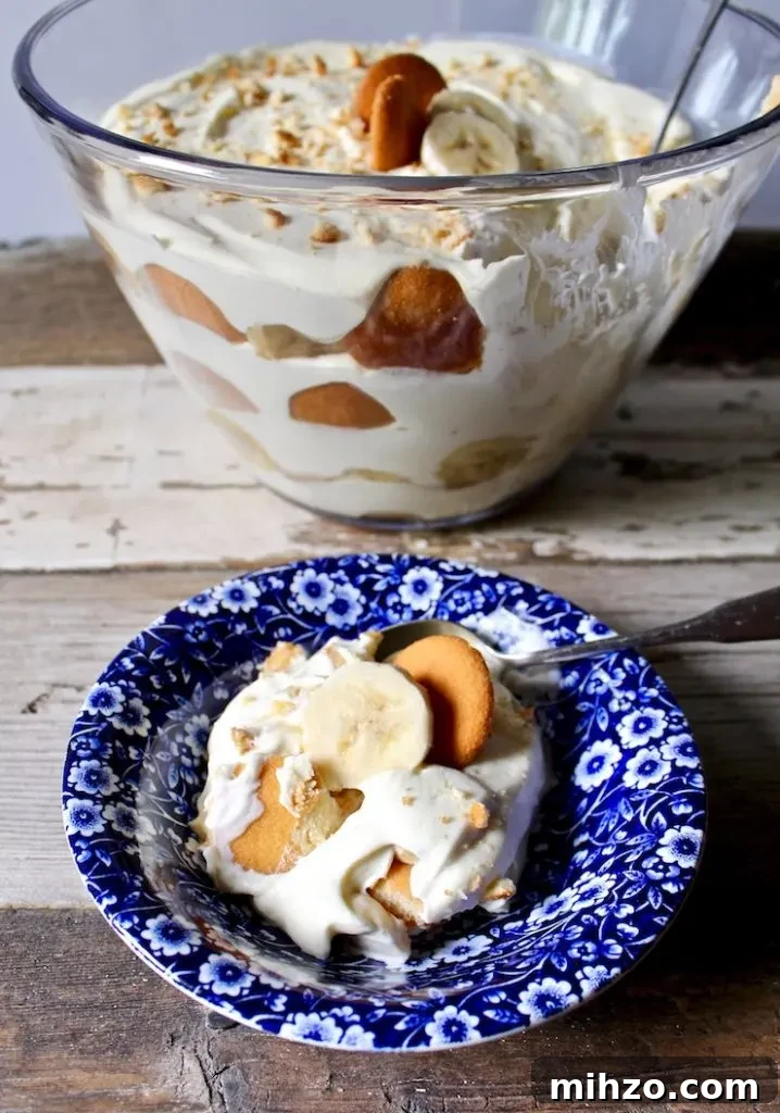 Magnolia Bakery-Style Banana Pudding Recipe That Impresses 3 Magnolia Bakery's Famous Banana Pudding, in blue dessert dish with trifle dish in background