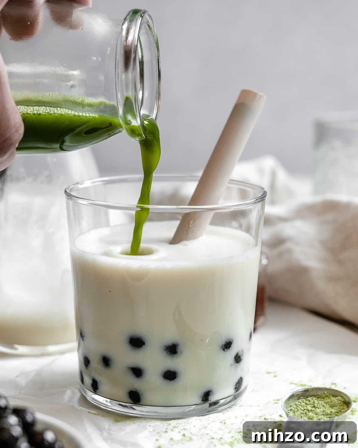 process shot of adding matcha powder to glass