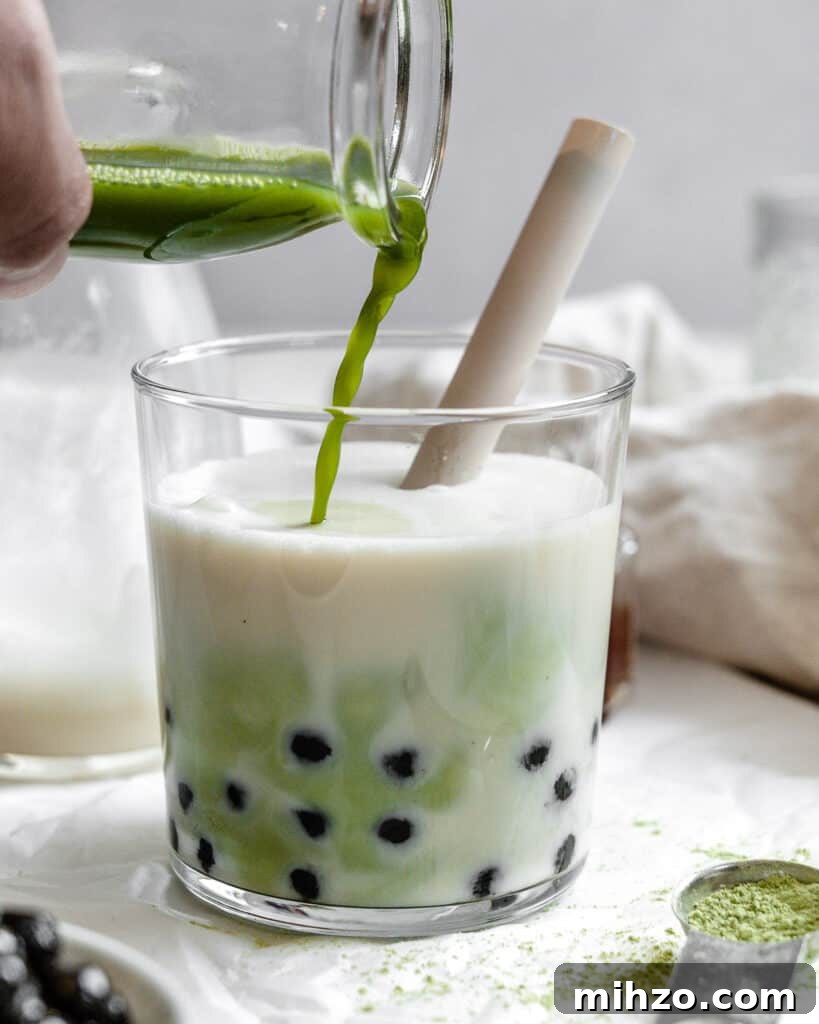 process shot of adding matcha powder to glass