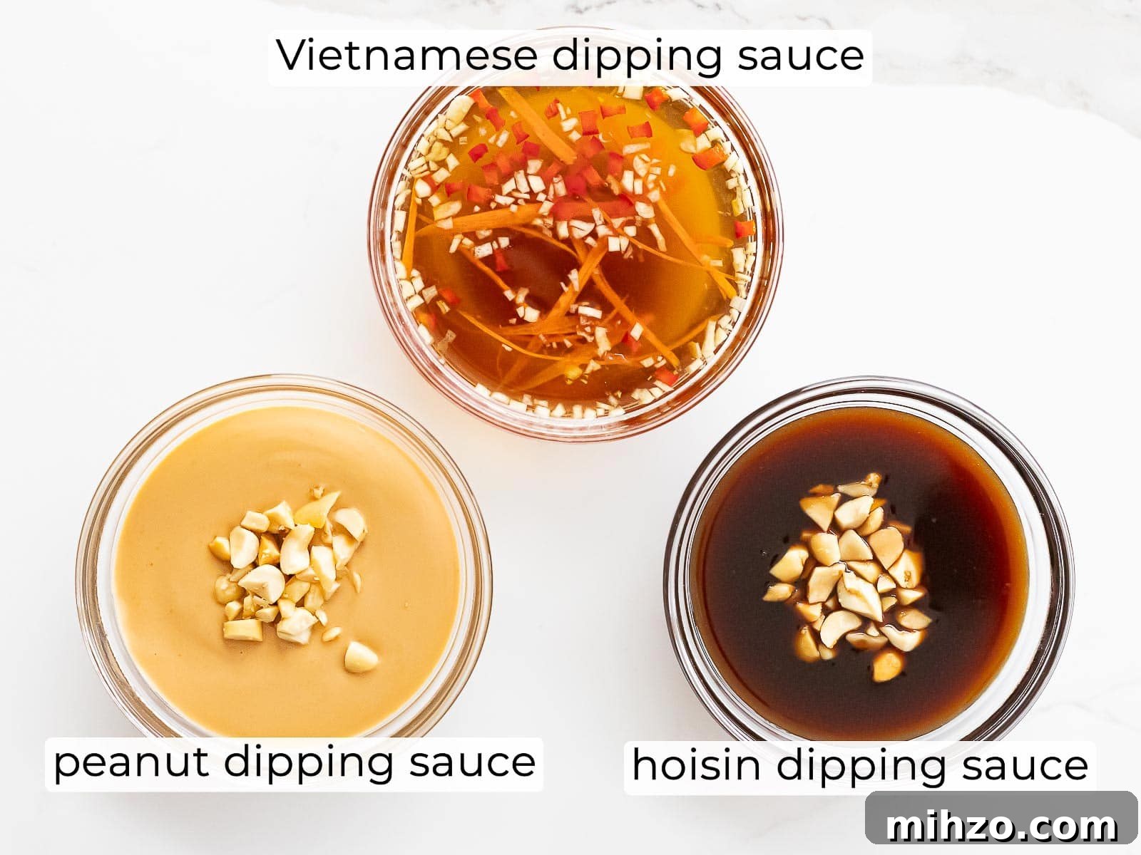 three spring roll dipping sauces including peanut, hoisin, and Vietnamese sauce