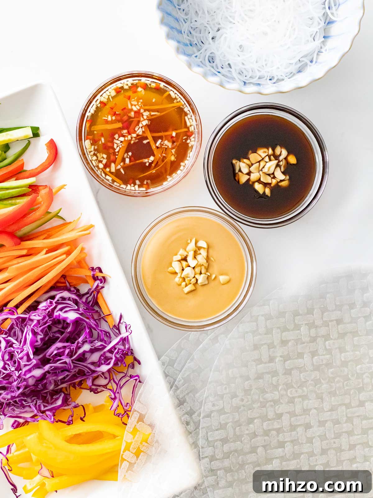 rainbow veggies with rice paper wrapper, dipping sauces, and vermicelli noodles