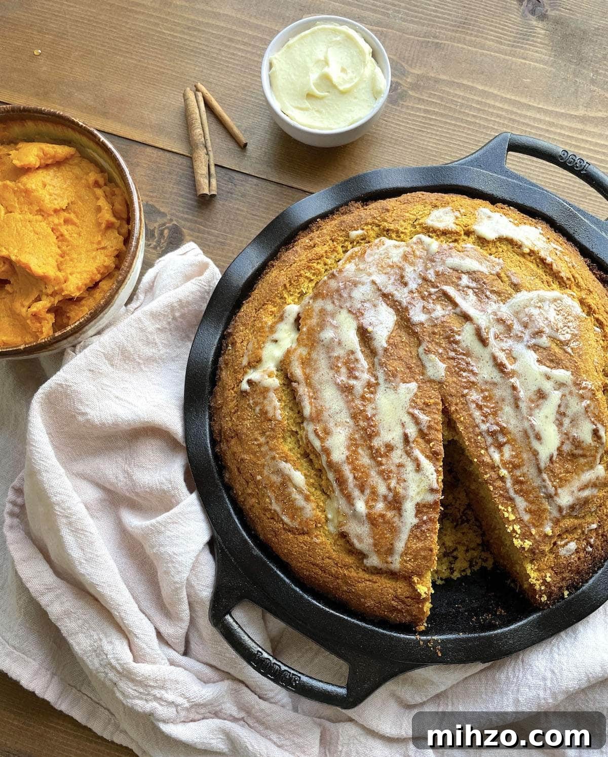 Whipped Honey Butter Recipe: Smooth, Spreadable & Quick 12 A bowl of sweet potato cornbread with honey butter spread on top.