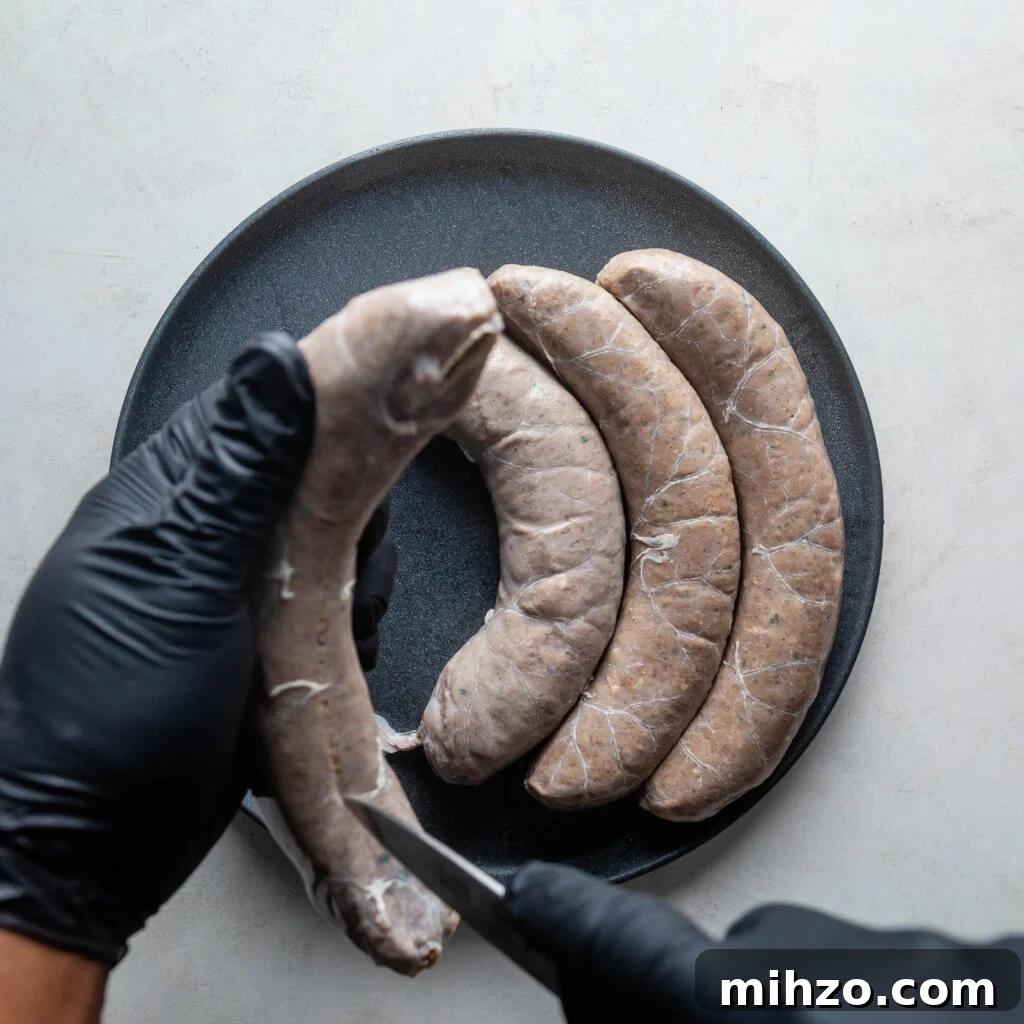 removing the casing from the boudin sausage