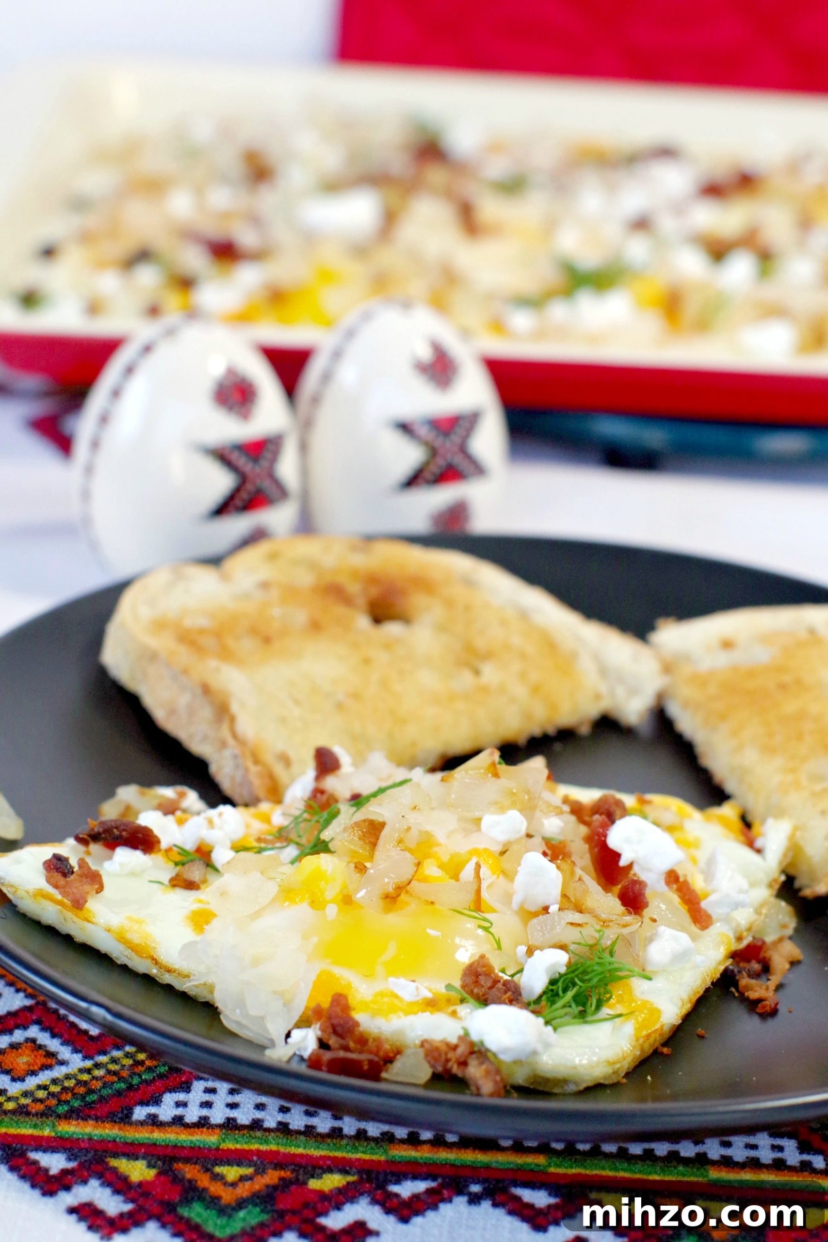 Ukrainian-Style Baked Eggs: Hearty Dinner Recipe 16 Sheet pan Ukrainian style eggs on plate with eggs on sheet pan in background