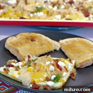 Ukrainian-Style Baked Eggs: Hearty Dinner Recipe 21 Sheet pan Ukrainian style eggs on plate with eggs on sheet pan in background