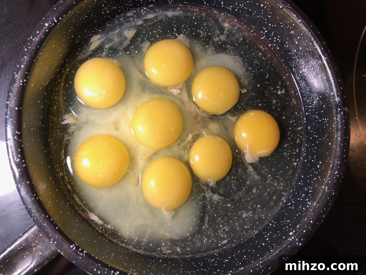 Ukrainian-Style Baked Eggs: Hearty Dinner Recipe 6 raw eggs in a frying pan