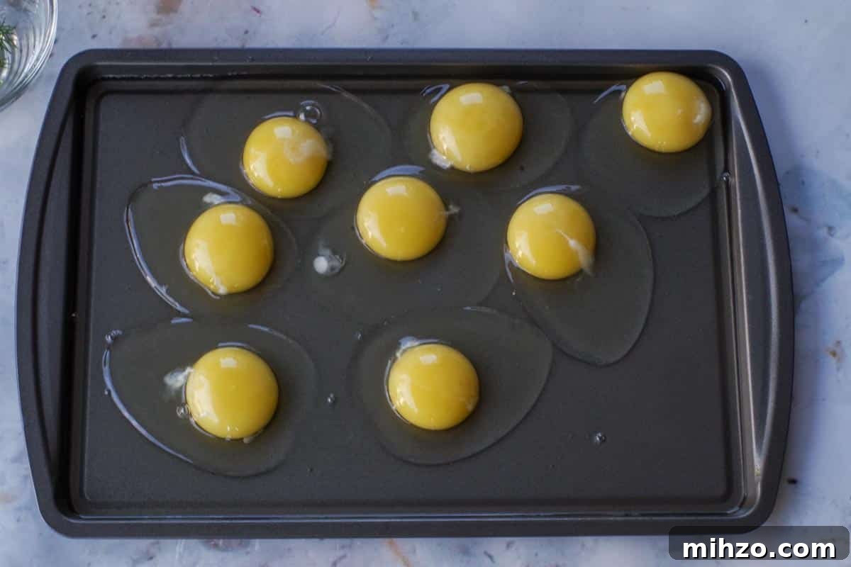 Ukrainian-Style Baked Eggs: Hearty Dinner Recipe 9 Raw eggs on a greased Sheet Pan
