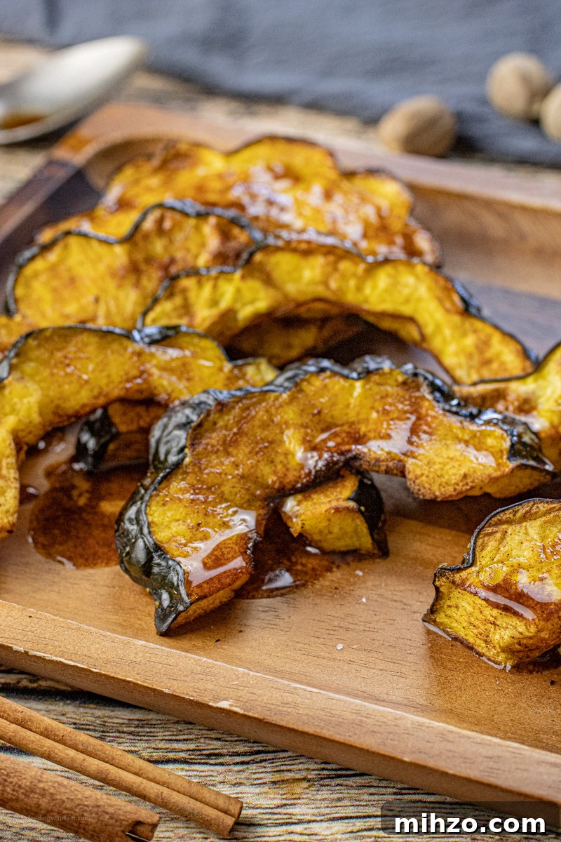 Crispy Roasted Acorn Squash in the Air Fryer 2 half moon slices of acorn squash cooked and drizzled with melted butter