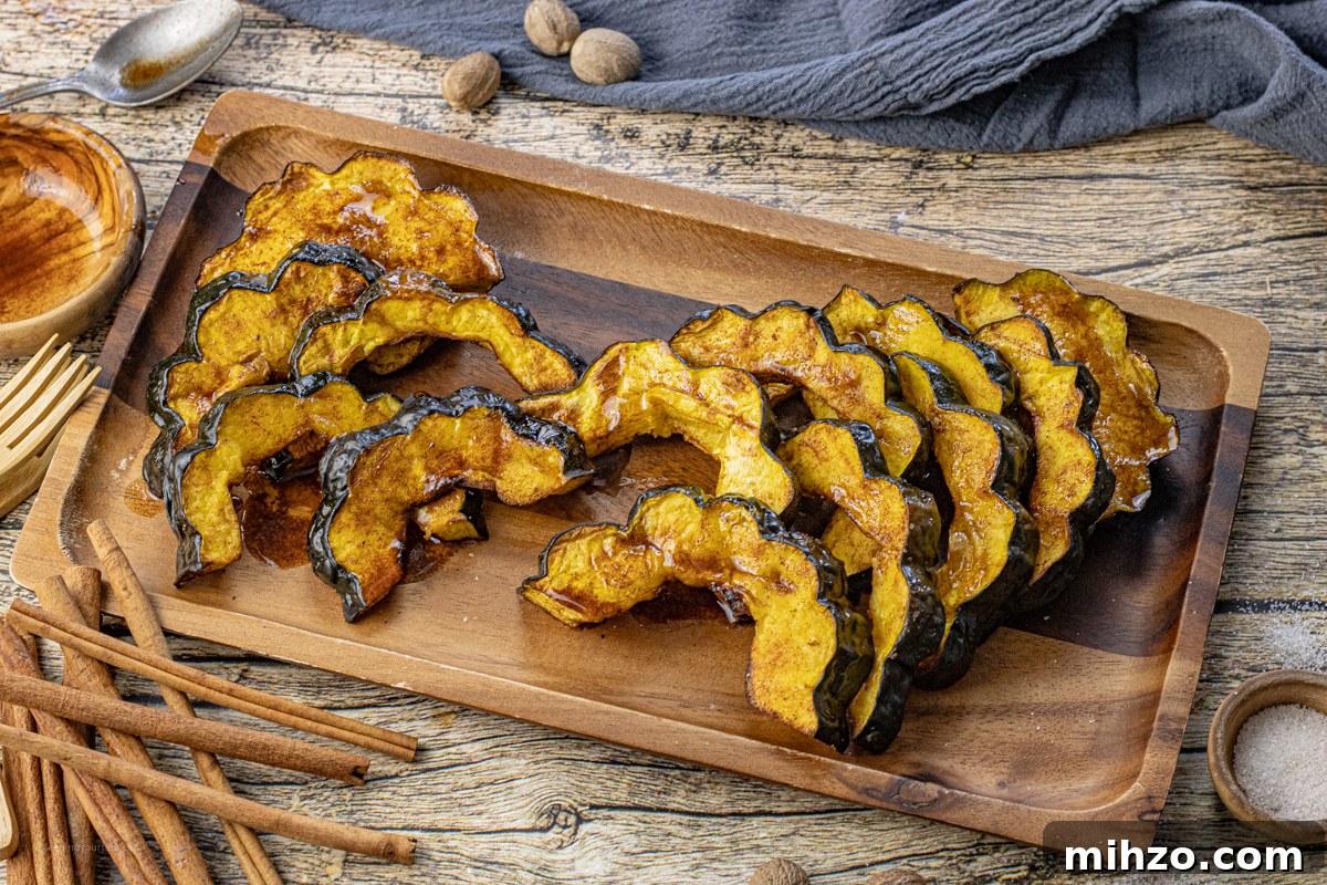 Crispy Roasted Acorn Squash in the Air Fryer 7 cooked slices of acorn squash on a wooden platter