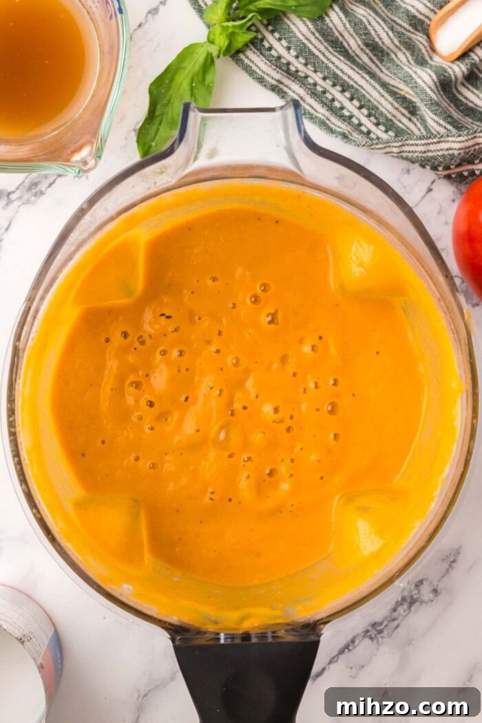 Creamy roasted tomato soup in a Vitamix blender.