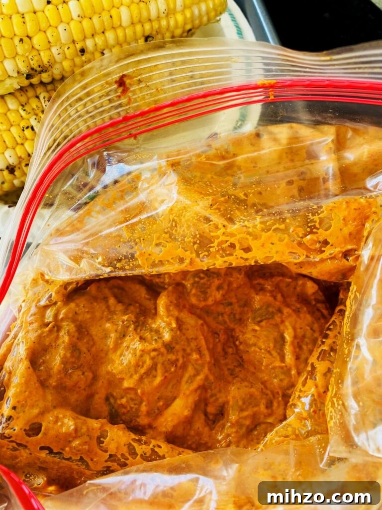 Maple Sriracha Grilled Chicken Recipe for Sweet-Spicy Flavor 2 marinating chicken in a bag