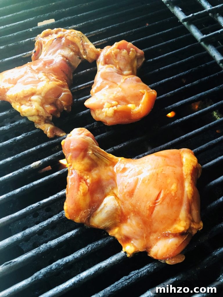 Maple Sriracha Grilled Chicken Recipe for Sweet-Spicy Flavor 3 chicken on the grill