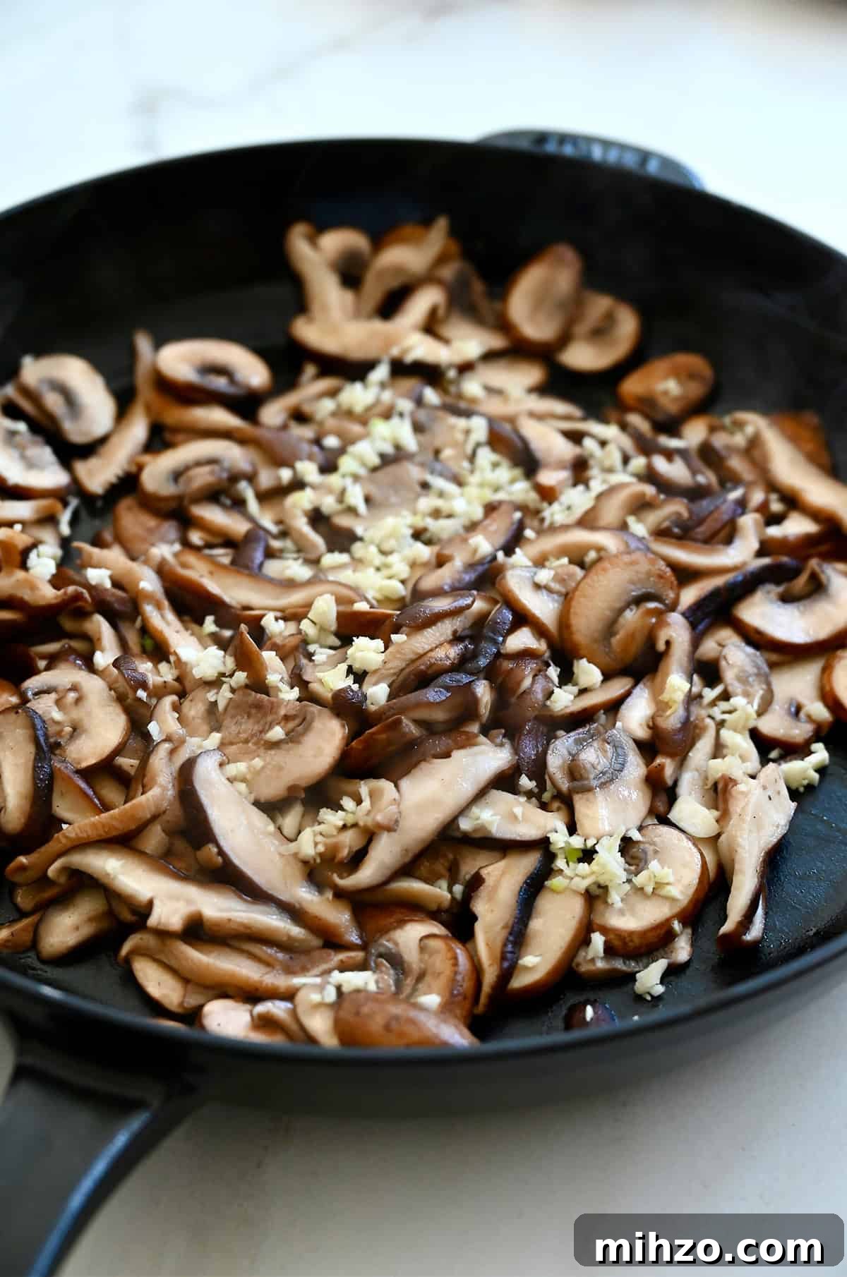 Creamy Garlic Mushroom Sauce for Pasta and Steak 6 Sautéed mushrooms in a large skillet with minced garlic.