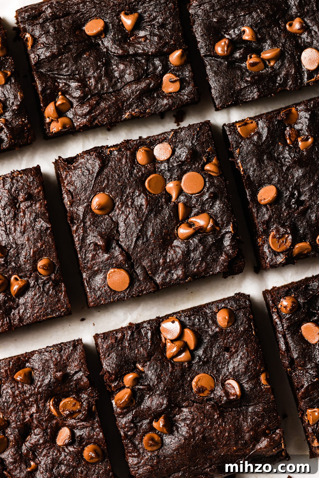 Fudgy Pumpkin Brownies with Warm Spice Flavor 10 A closeup of healthy pumpkin brownies cut into squares.