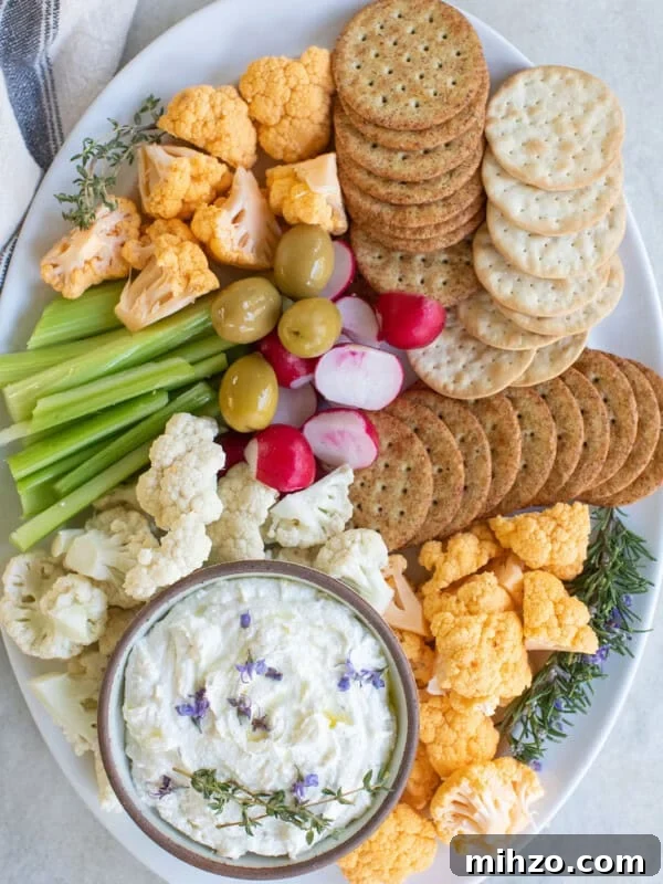 platter with crackers, vegetables and goat cheese dip