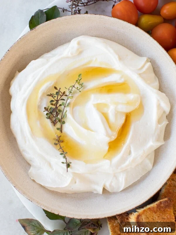 Creamy whipped ricotta with honey drizzled over the top,