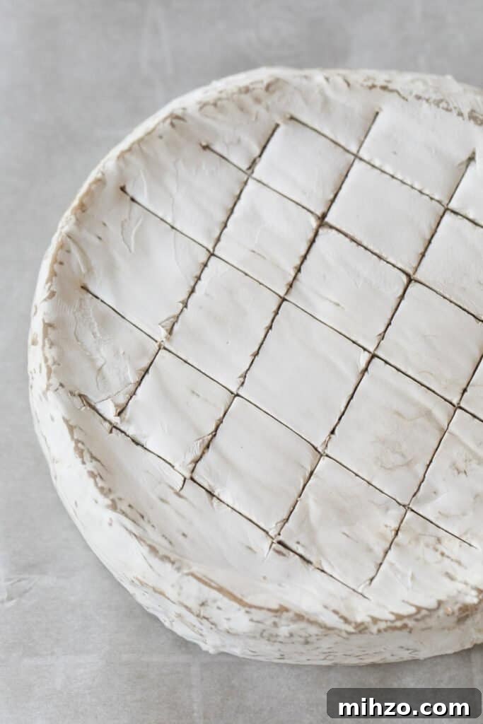 Slices cut into brie cheese.