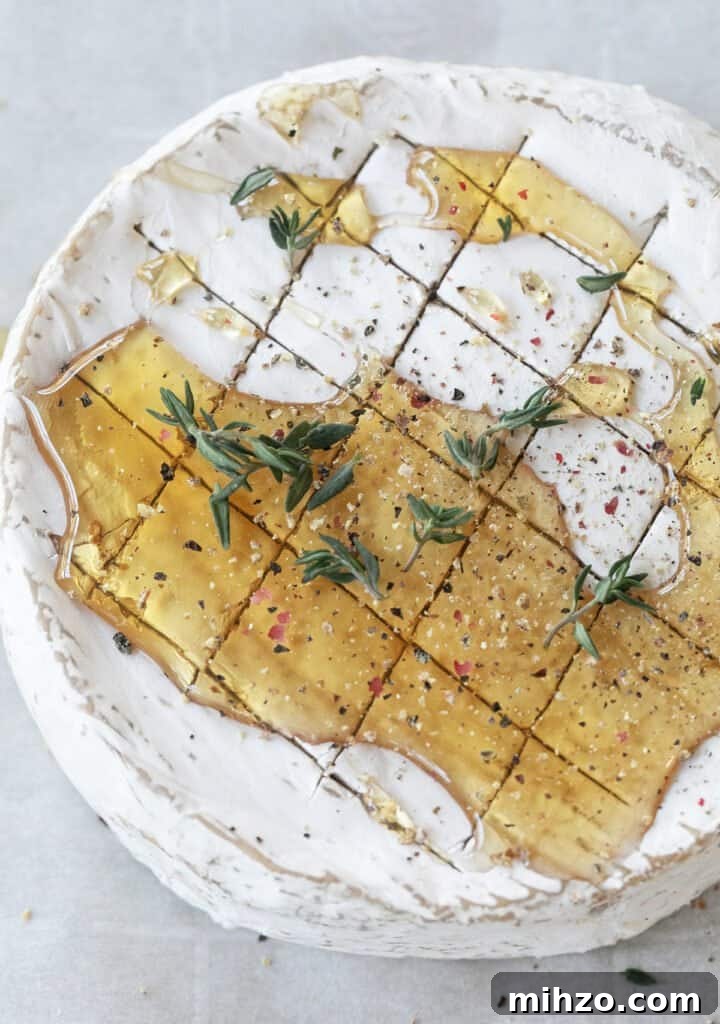 Brie cheese with honey and herbs.