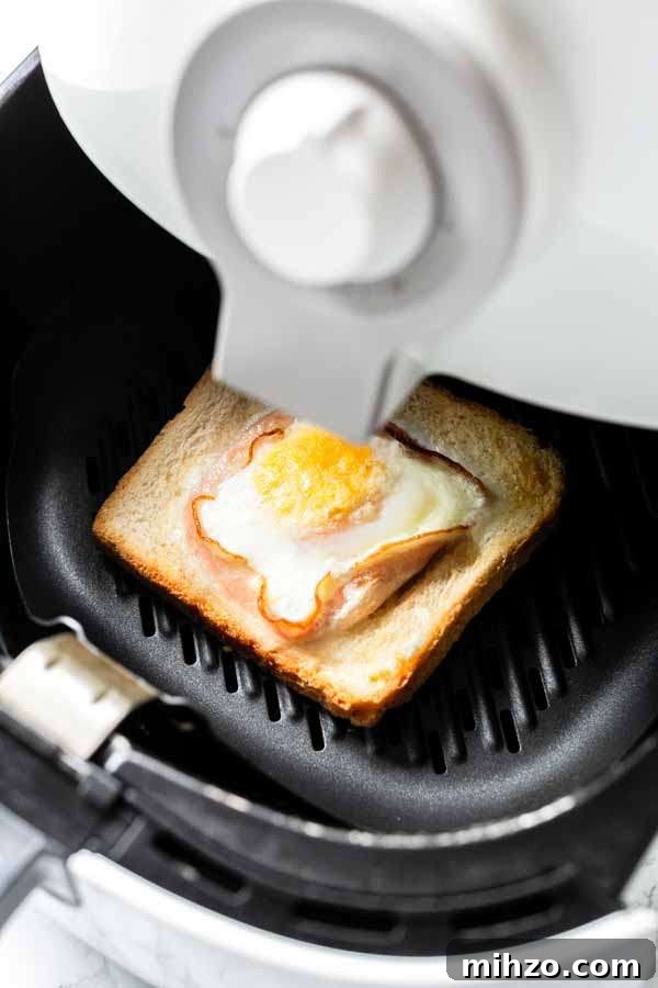 Crispy Bacon and Egg Toast Made in the Air Fryer 3 Egg toast with bacon in Air Fryer