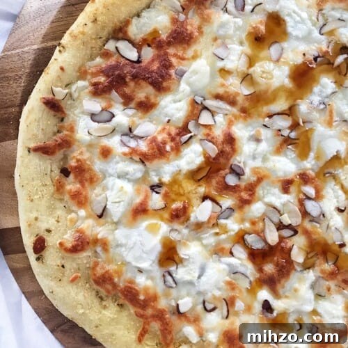 three cheese pizza with honey and almonds