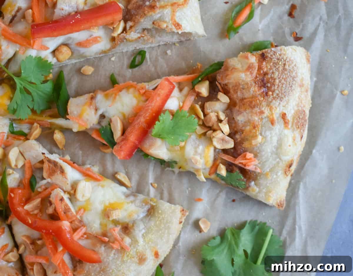 Thai Chicken Pizza Recipe: Tangy Peanut Sauce & Crispy Crust 7 slice of thai chicken pizza on brown paper.