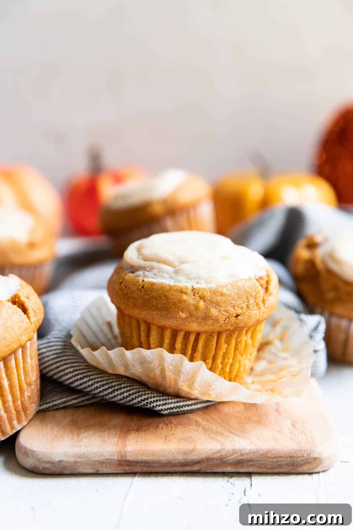 Pumpkin Cream Cheese Muffins with Cinnamon Swirl 2 pumpkin cream cheese muffins.