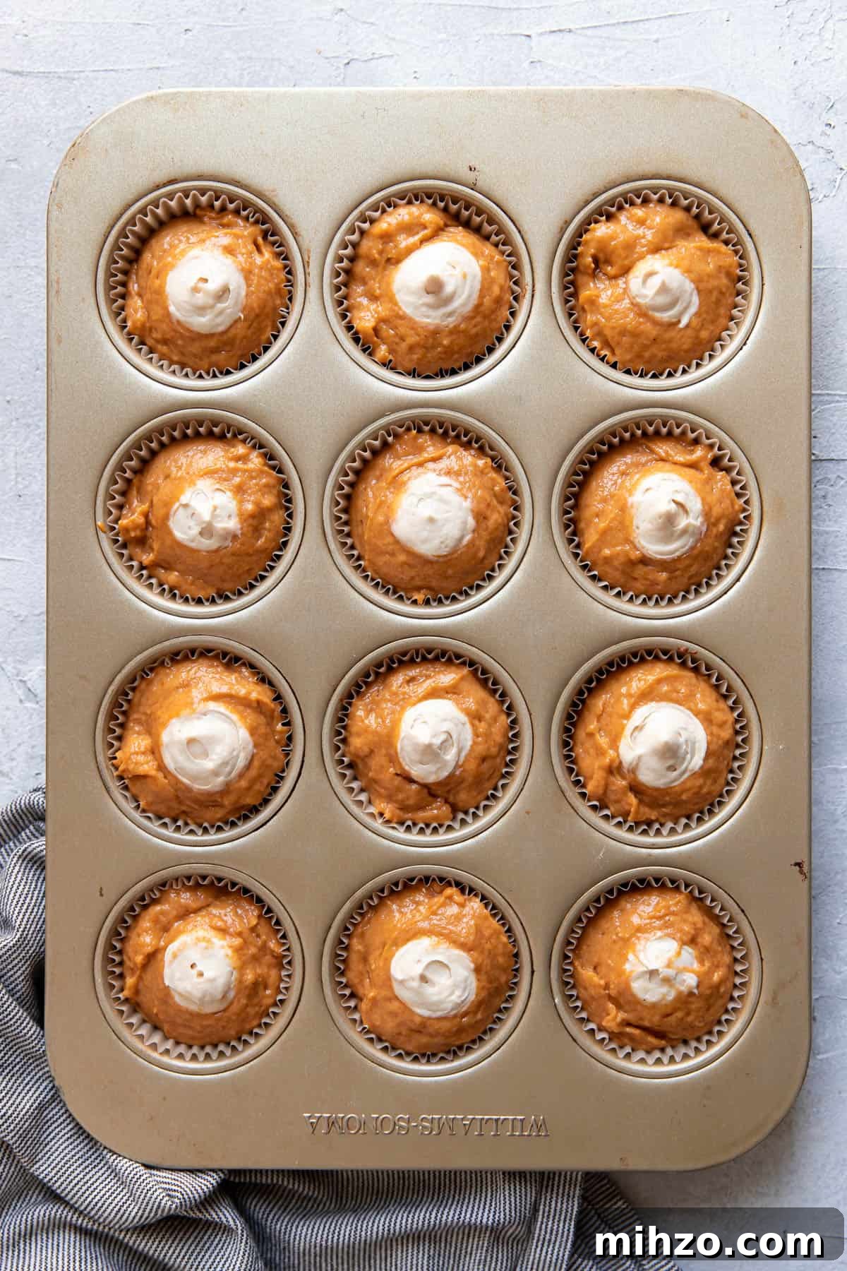 Pumpkin Cream Cheese Muffins with Cinnamon Swirl 7 pumpkin cream cheese muffins before baking.
