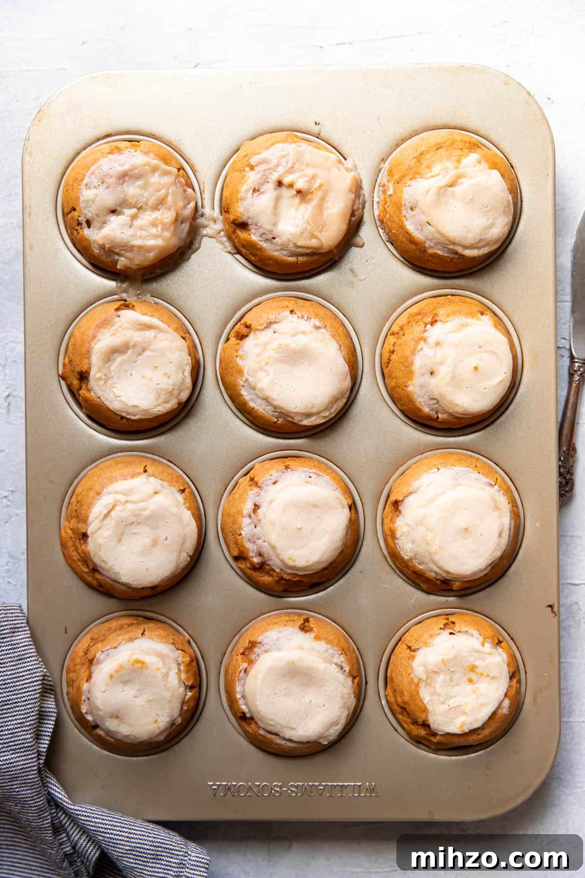 Pumpkin Cream Cheese Muffins with Cinnamon Swirl 8 pumpkin cream cheese muffins after baking.