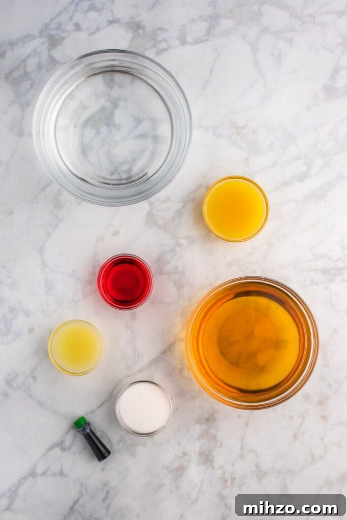 Toxic Waste Punch Recipe: How to Make a Neon Party Drink 3 Glass bowls of ingredients including apple juice, pineapple juice, lime juice, grenadine, sugar, and green food coloring on marble surface.