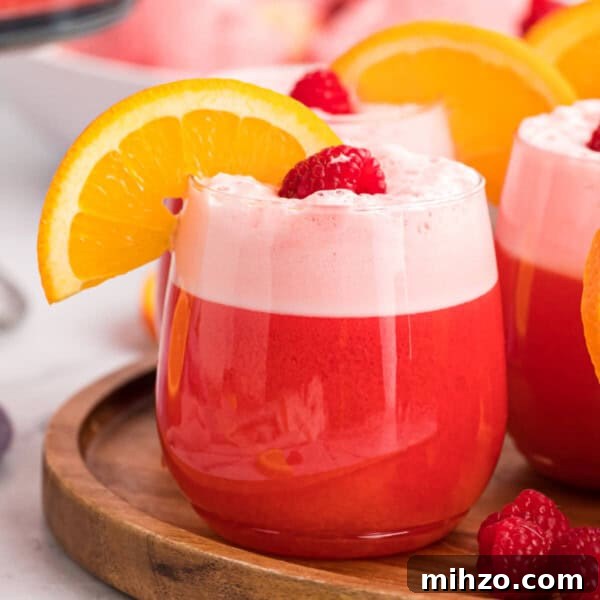 Toxic Waste Punch Recipe: How to Make a Neon Party Drink 22 sherbet party punch in a clear glass