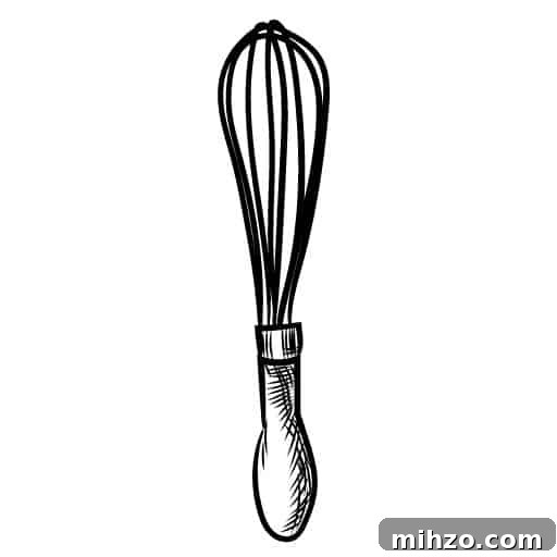 Creamy Homemade Tartar Sauce for Seafood 7 Image of a whisk