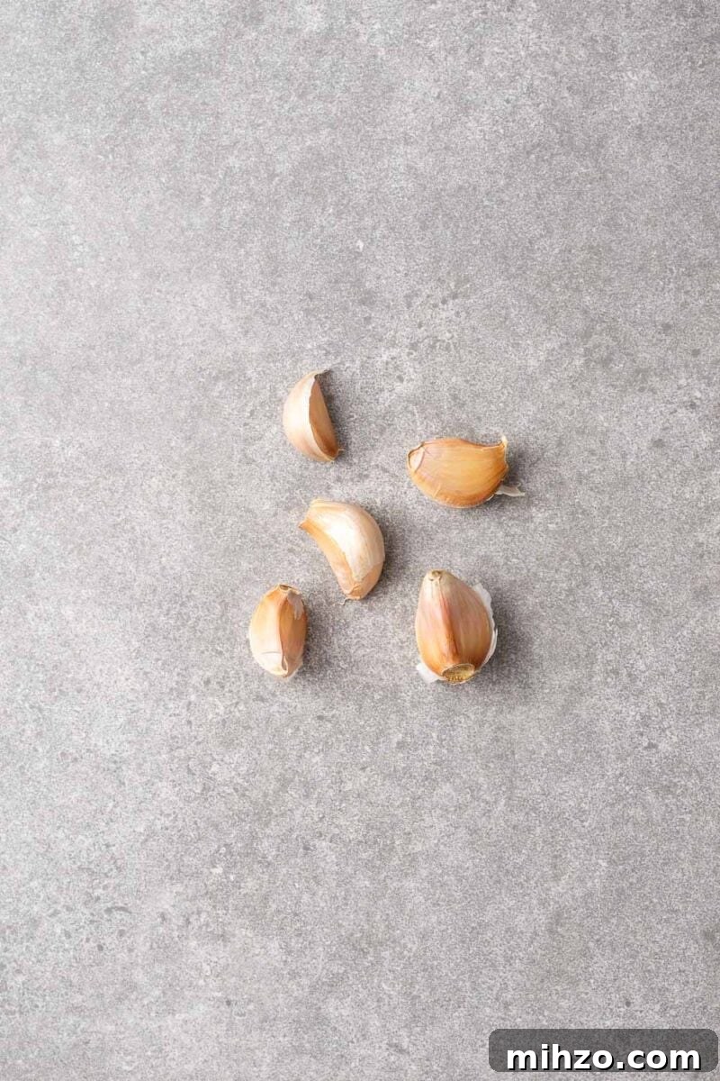 Five unpeeled garlic cloves