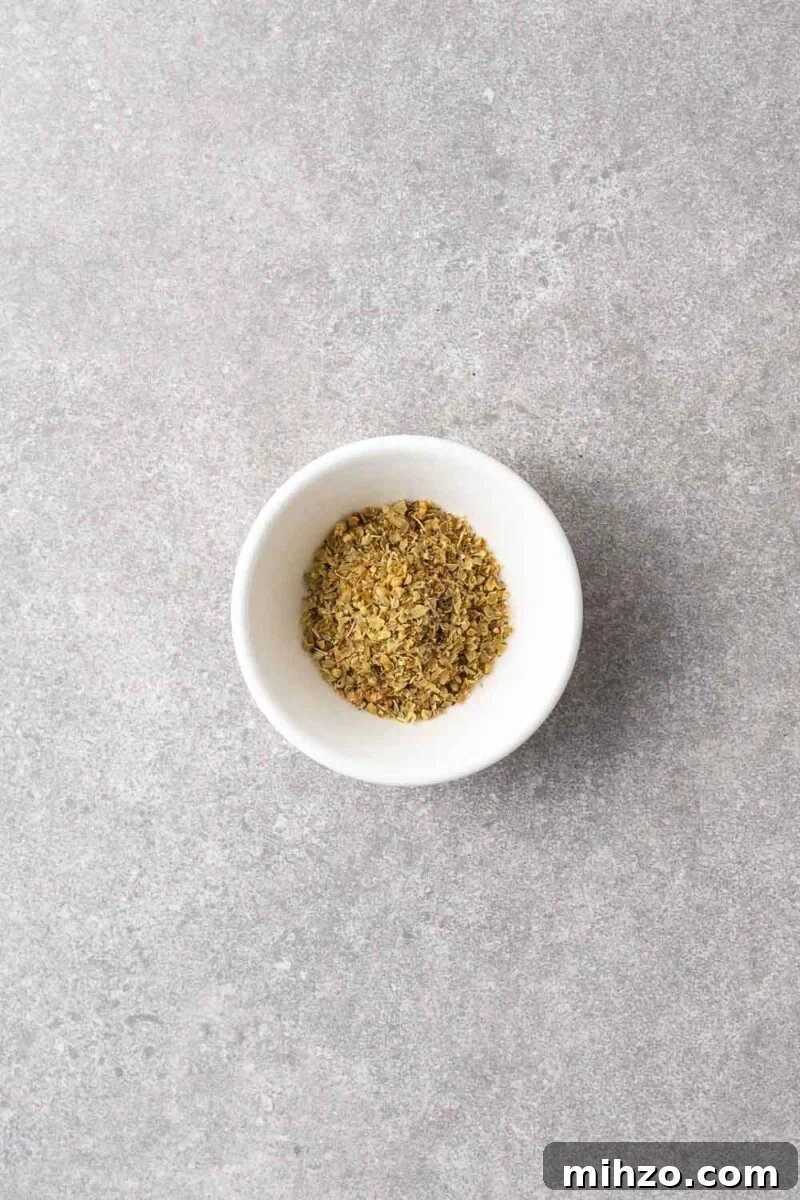 A small bowl with dried oregano.