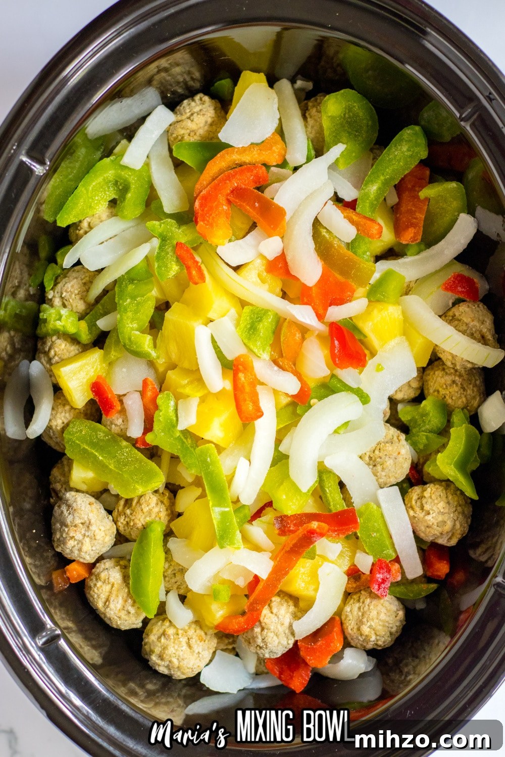 Slow Cooker Hawaiian-Style Pineapple Meatballs 5 peppers, pineapple, and frozen meatballs in a slow cooker