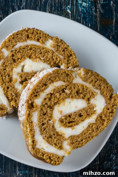 Perfect Homemade Pumpkin Roll Cake Recipe for Fall Guests 2 sliced pumpkin roll