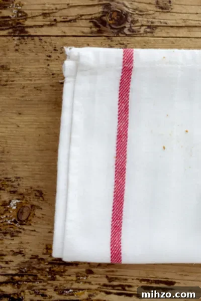 Perfect Homemade Pumpkin Roll Cake Recipe for Fall Guests 5 tea towel
