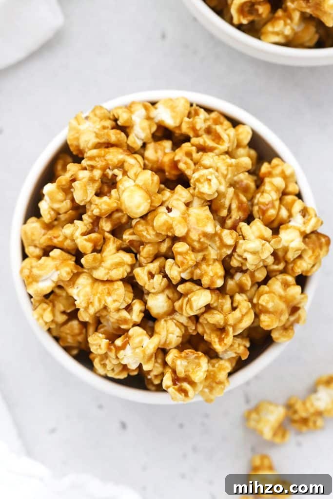 Homemade Caramel Sauce Recipe: Smooth, Pourable & Quick 13 overhead view of two white bowls of crispy homemade caramel corn