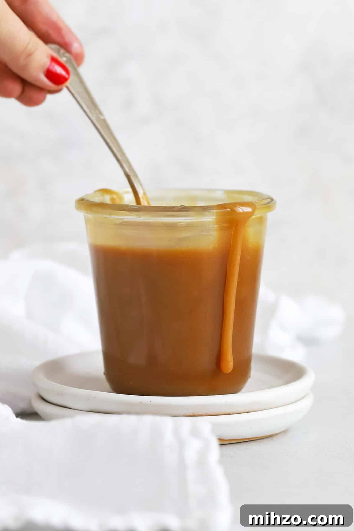 Homemade Caramel Sauce Recipe: Smooth, Pourable & Quick 9 front view of a jar of easy caramel sauce
