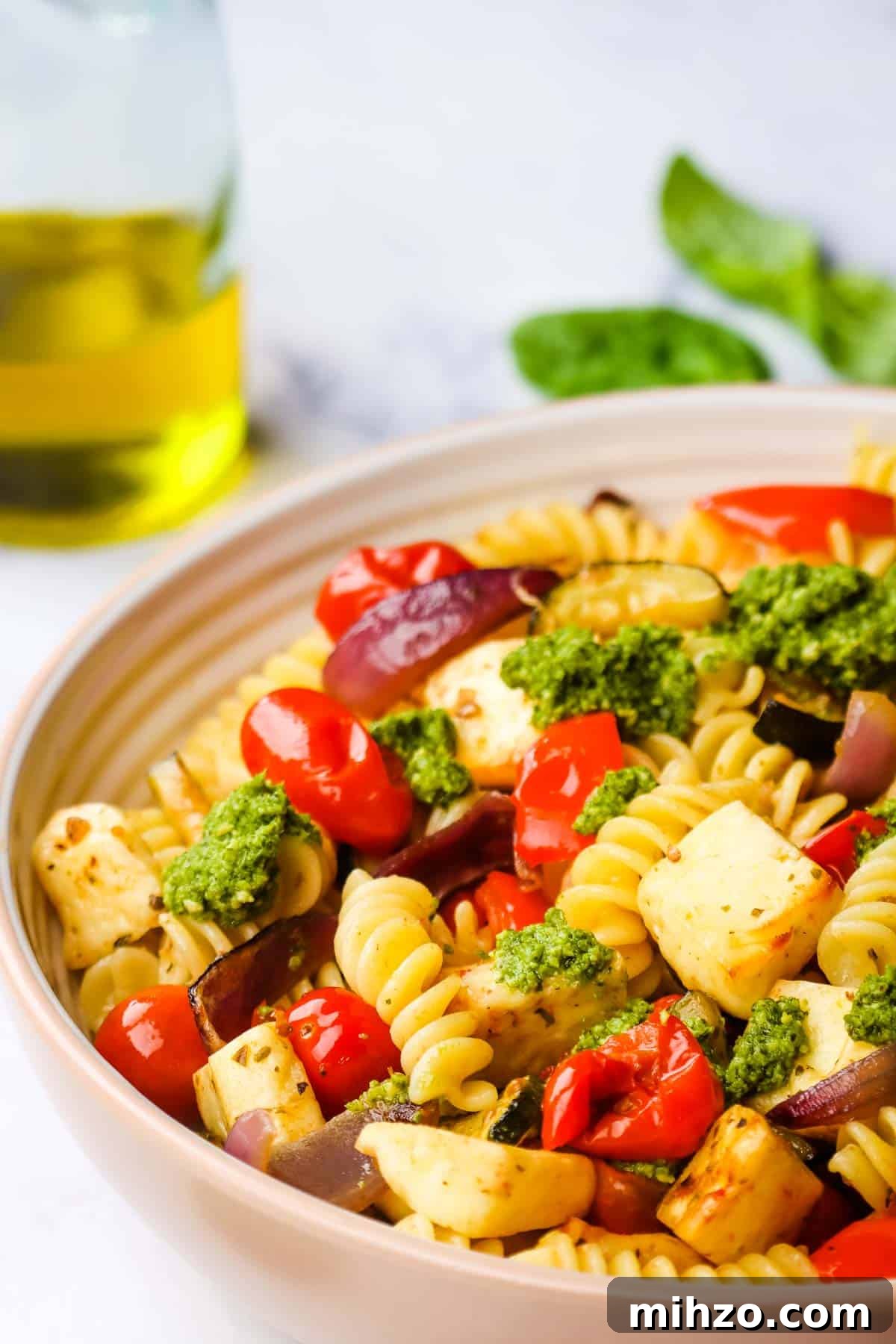 Creamy Halloumi Pasta with Cherry Tomatoes and Basil 2 Halloumi pasta served on a plate.