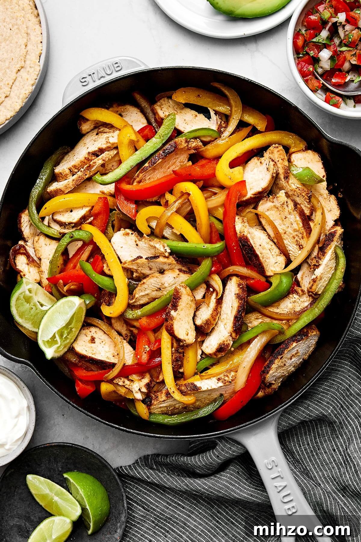 A skillet of chicken fajitas.