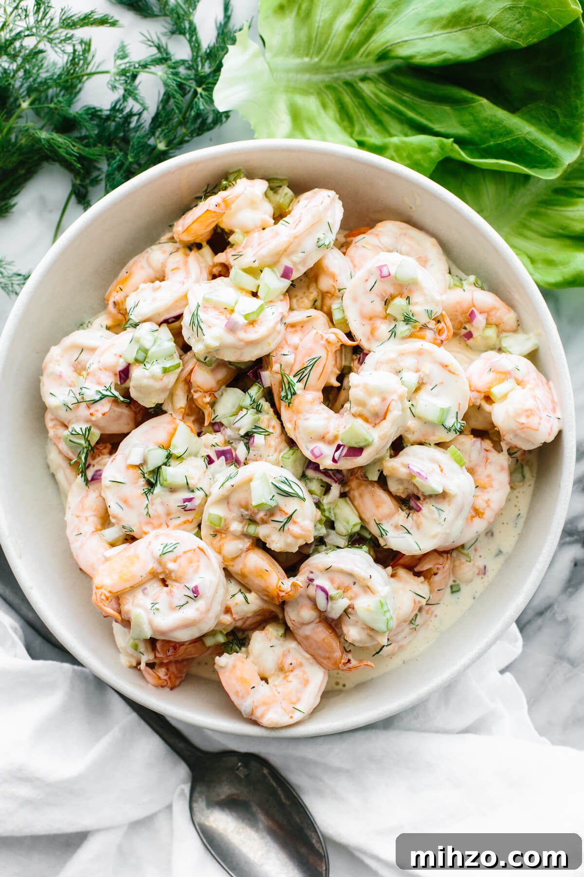 Shrimp salad in a large white bowl