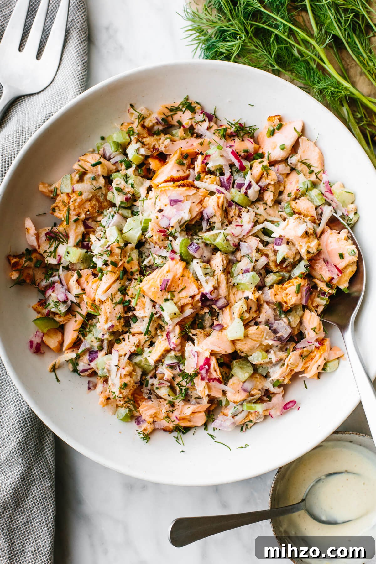 Salmon salad in a large white bowl